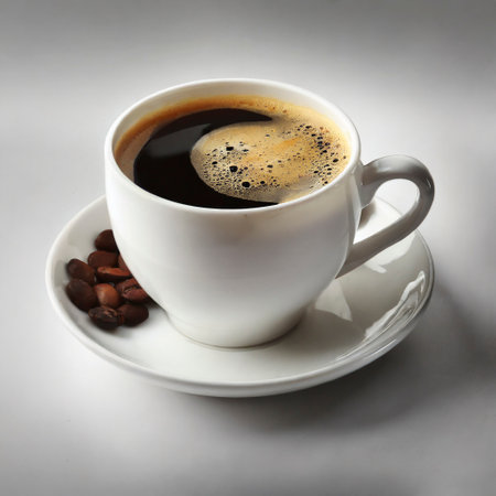 Cup of coffee with beans on grey background, top view.の素材