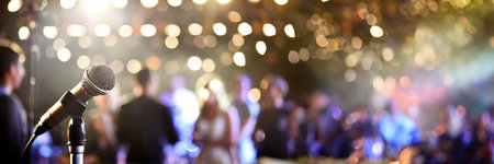 Microphone on stage with crowd of people in background, panoramaの素材