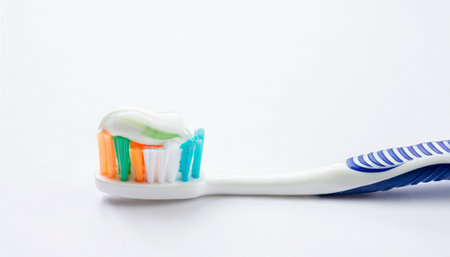 Toothbrush with toothpaste on white background, close up.の素材