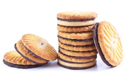 Sandwich biscuits with chocolate filling isolated on white background, sweet foodの素材