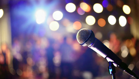 Microphone on stage with bokeh background, live music concertの素材