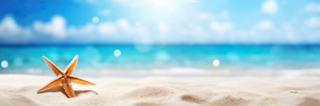 Starfish on sandy beach with blue sea and sky background. Summer vacation concept.の素材