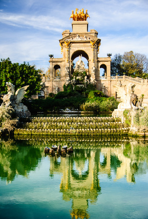 Fountain with reflection in the pond in Citadel Park, Barcelonaの写真素材