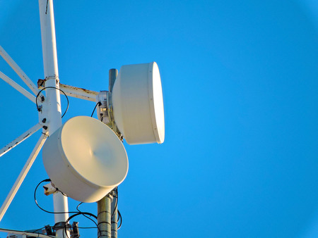 Telecommunication tower against the blue sky, cell antenna, transmitter. Telecom TV radio mobile...