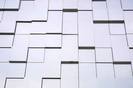 Abstract white gray metal mirrored wall, 3D metal futuristic surface, modern building design