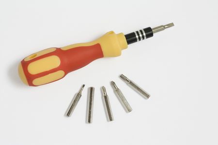 Screwdriver whith a bits on a white backgroundの写真素材