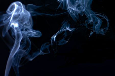Stream of a blue smoke on a black backgroundの写真素材