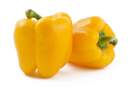 Two yellow peppers on white backgroundの写真素材