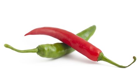 Red and green chili peppers on white backgroundの写真素材