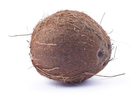 Brown ripe coconut on white background