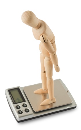 Mannequin standing on digital scale isolated on white backgroundの写真素材
