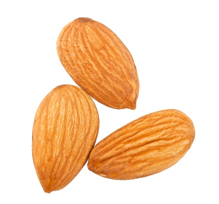 Three almond nuts isolated on white background の写真素材