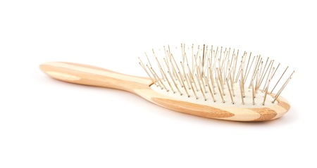Wooden hairbrush isolated on white background 