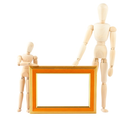 Two wooden dummy and empty frame isolated on white backgroundの写真素材