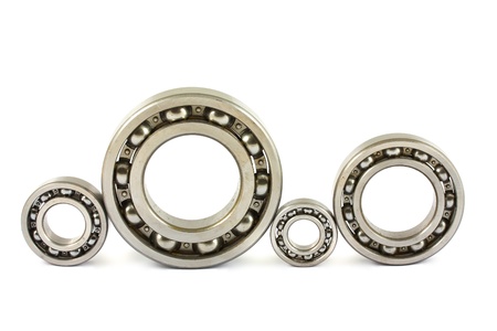 Four steel ball bearings isolated on a white backgroundの写真素材