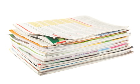 Stack of old magazines isolated on white background