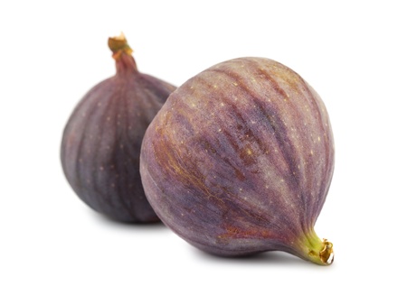 Pair of ripe purple fig fruits isolated on white backgroundの写真素材