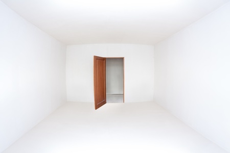 Opened door in the empty white room, wide angle lens shotの写真素材