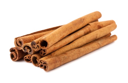 Brown dry cinnamon sticks isolated on white backgroundの写真素材