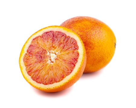 Half and full of blood red oranges isolated on white backgroundの写真素材