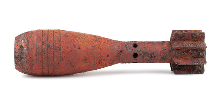 Rusty mortar shell isolated on white backgroundの写真素材
