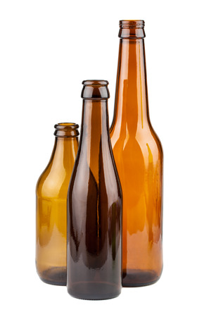 Three empty brown bottles isolated on white backgroundの写真素材