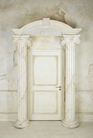 Classic interior with columns and closed doorの写真素材