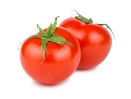 Pair of ripe red tomato isolated on white backgroundの写真素材