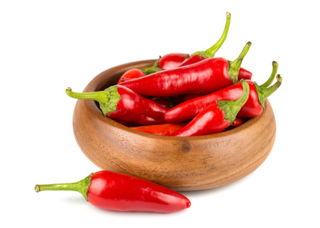 Red hot chili peppers in wooden bowl on a white backgroundの写真素材