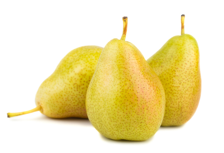 Three ripe yellow pears isolated on white backgroundの写真素材