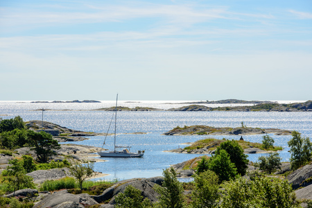 Sailboat moored at small rocky island in the outer part of the archipelago of Stockholm, Swedenの写真素材