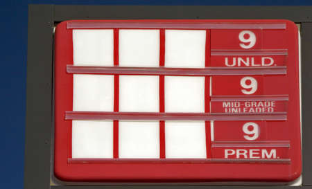 Filling station without any numbers for the prices of a gallon of gasoline.  Implying numbers changing so quickly the station can't keep up.の写真素材