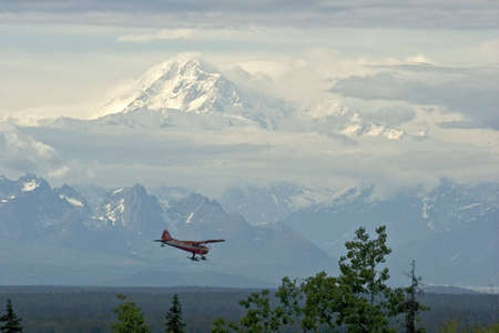 A view of Mt. McKinley (Denali) in Alaska with plane coming in for a landing as seen from Talkeetna,...