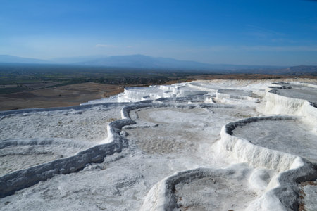 White travertine natural thermal pools and terraces of Pamukkale were used as spa in  second century and are famous for  healing properties rich in minerals like sulfur and silica.の写真素材