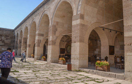 Covered areas for travelers and animals surround courtyard of SultanhanÄ± Caravanserai, Aksaray Province, Turkey, built to protect merchants traveling along the ancient Silk Route.の写真素材