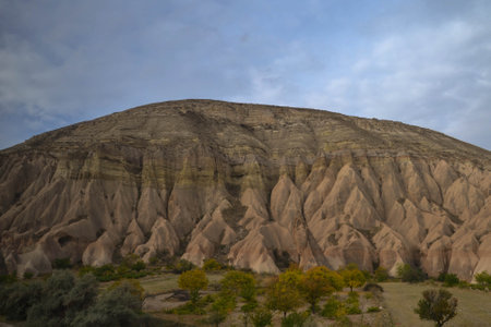 Unique rock formations, Cappadocia, Turkey, shaped by deposits from rivers, volcanic eruptions and lava flow form chimney-like cave-dwelling structures called fairy chimneys.の写真素材