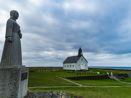 Strandarkirkja church with a statue on a cloudy day in south west icelandのeditorial素材