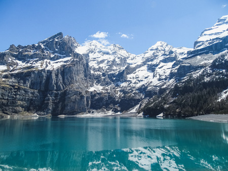 Amazing tourquise Oeschinnensee with Swiss Alps Kandersteg switzerlandの写真素材