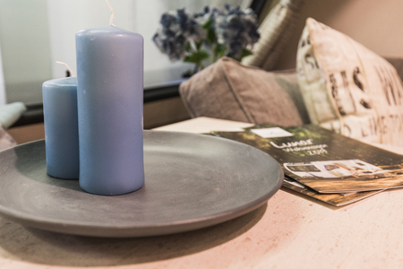 decorative blue candles and a sale prospect on a table, switzerlandの写真素材