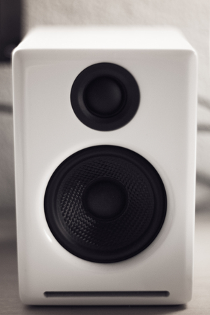 monochrome close up of a white piano lacquer desktop speaker, designの写真素材