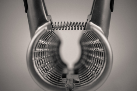 monocrome macro shot of a metal garlic press, kitchenの写真素材