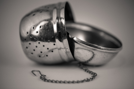 monocrome macro shot of a metal tea strainer, kitchenの写真素材