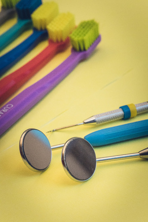 Detailed close up of different dental instruments and tools on a table, dentistryの写真素材