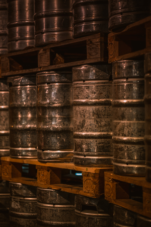 shining aluminum beer barrels stacked in a brewery, switzerland
