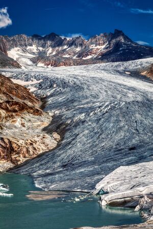 panorama of melting rhone glacier in swiss alps, switzerlandの写真素材