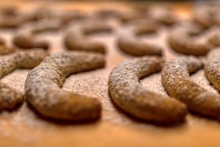 handmade christmas cookies after baking on an oven sheet, kitchenの写真素材