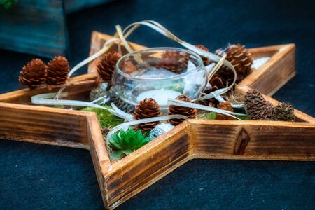 Colorful christmas decoration with pine cones and candles, festiveの写真素材