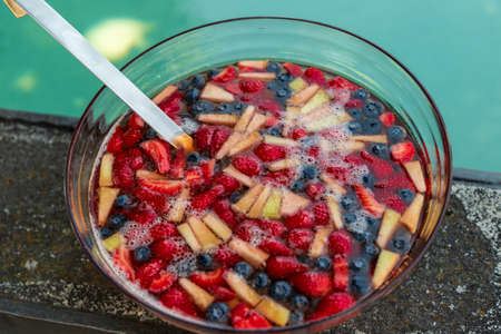 colorful fruit salad with strawberries, blueberries, mango and pineapple, foodの写真素材