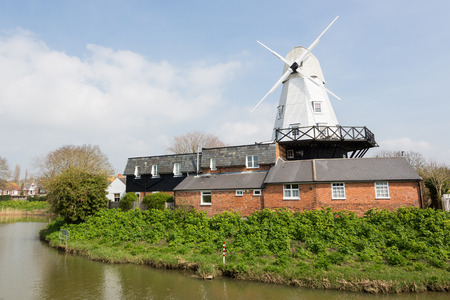 White gibbet windmill by the river Tillingham in Rye, East Sussex, England, UK.Photo taken on April...