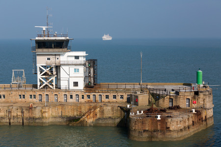 Dover Port Control at the Eastern Harbour Entrance with a approaching ship at sea.Photo taken on...